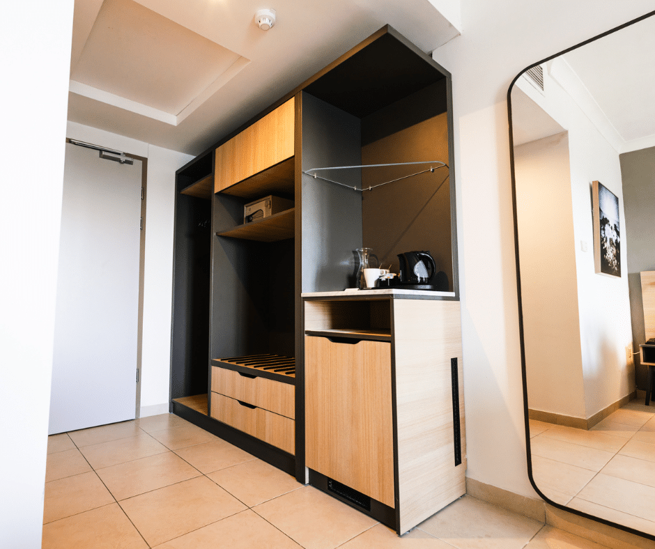 Custom hotel wardrobe, luggage storage and minibar furniture at Qawra Palace Resort & Spa Malta