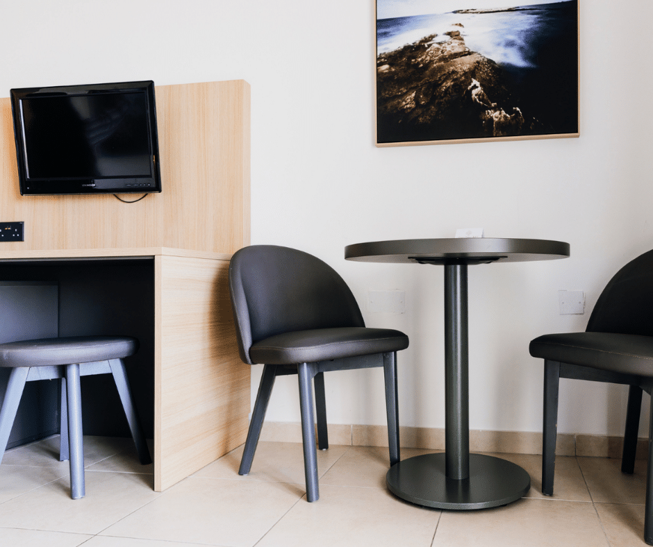 Hotel room table and seating furniture at Qawra Palace Resort & Spa in Qawra Malta
